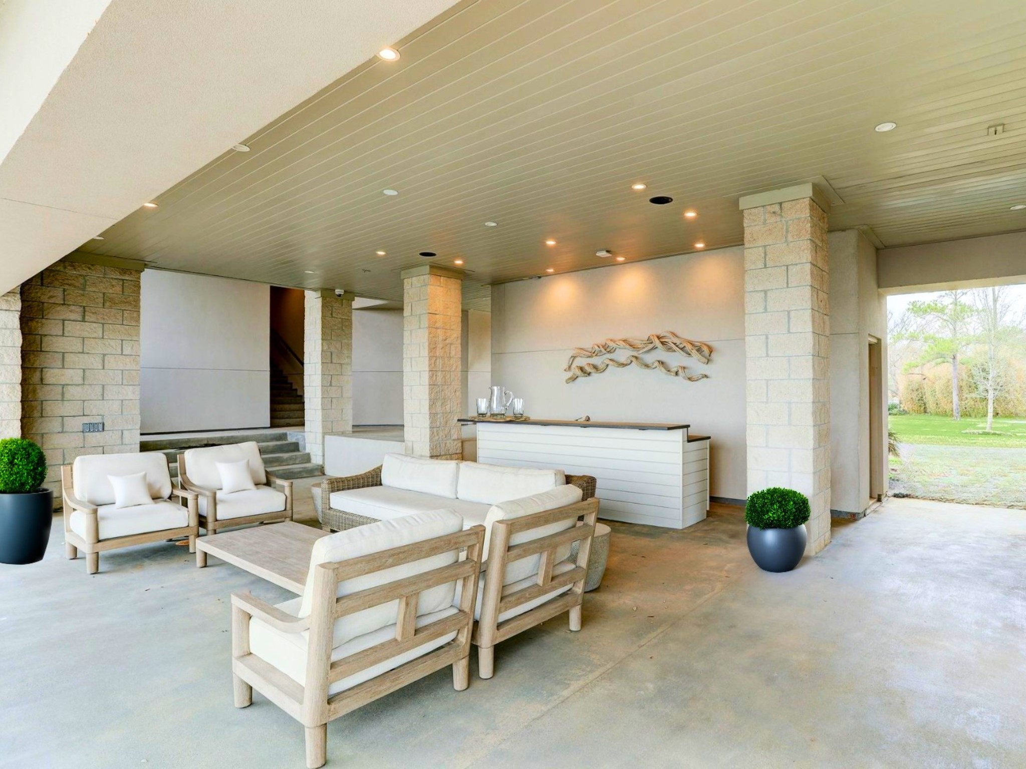 633 Quintana Roo Place Seabrook, TX 77586 - Photo 34 of 47 This poolside summer kitchen and lounge area is located under a breezeway with access to a convenient locker room - pool parties have never been more ideal.