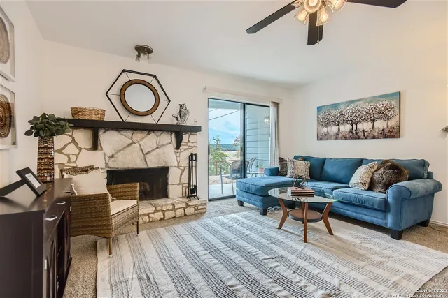 a kitchen with a table and a chandelier