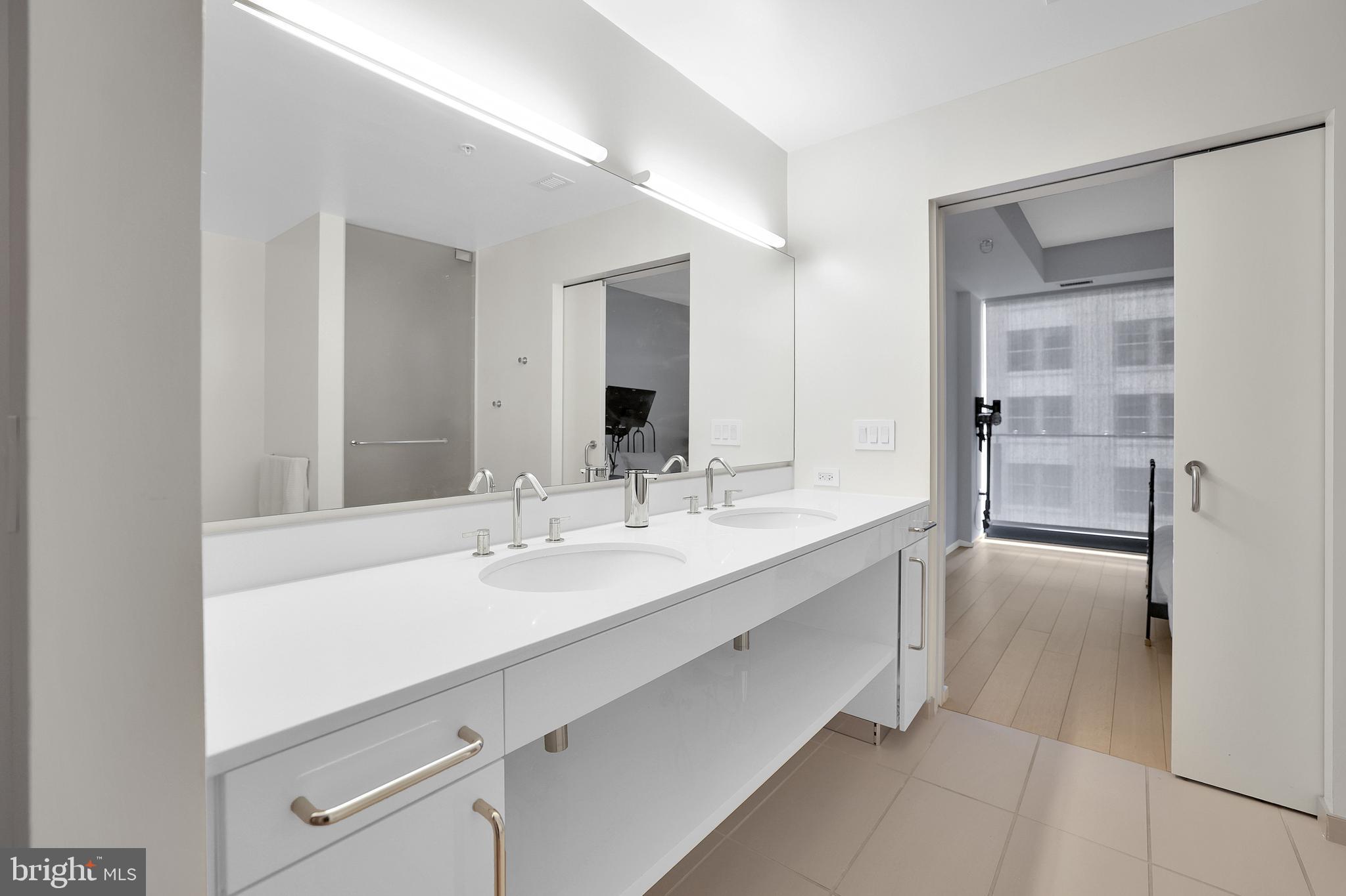 925 H Street Northwest, Unit 506 Washington, DC 20001 - Photo 16 of 36 a bathroom with a sink and a mirror