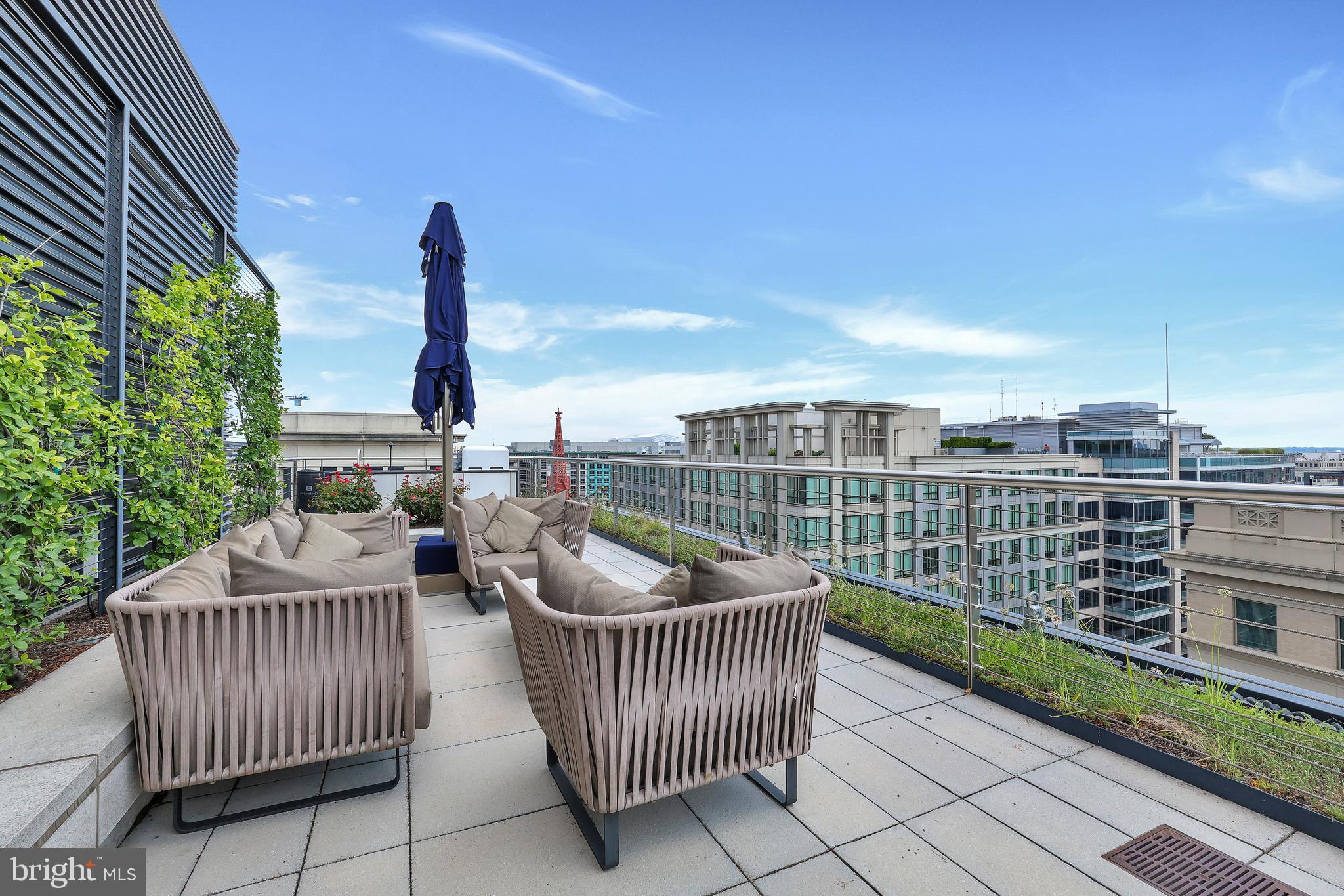 925 H Street Northwest, Unit 506 Washington, DC 20001 - Photo 27 of 36 a roof deck with couch and chairs