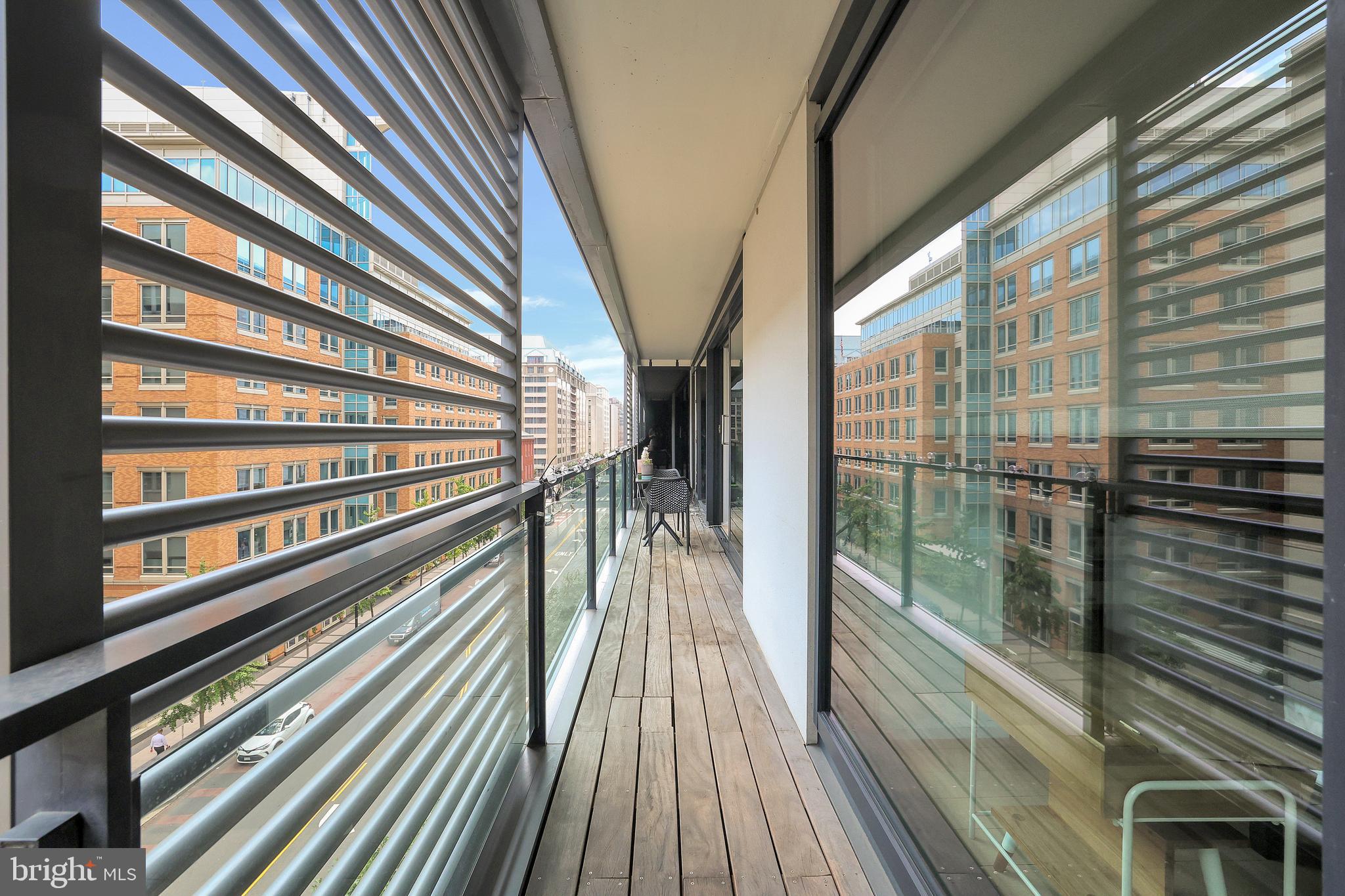 925 H Street Northwest, Unit 506 Washington, DC 20001 - Photo 8 of 36 a view of balcony with floor to ceiling windows with wooden floor