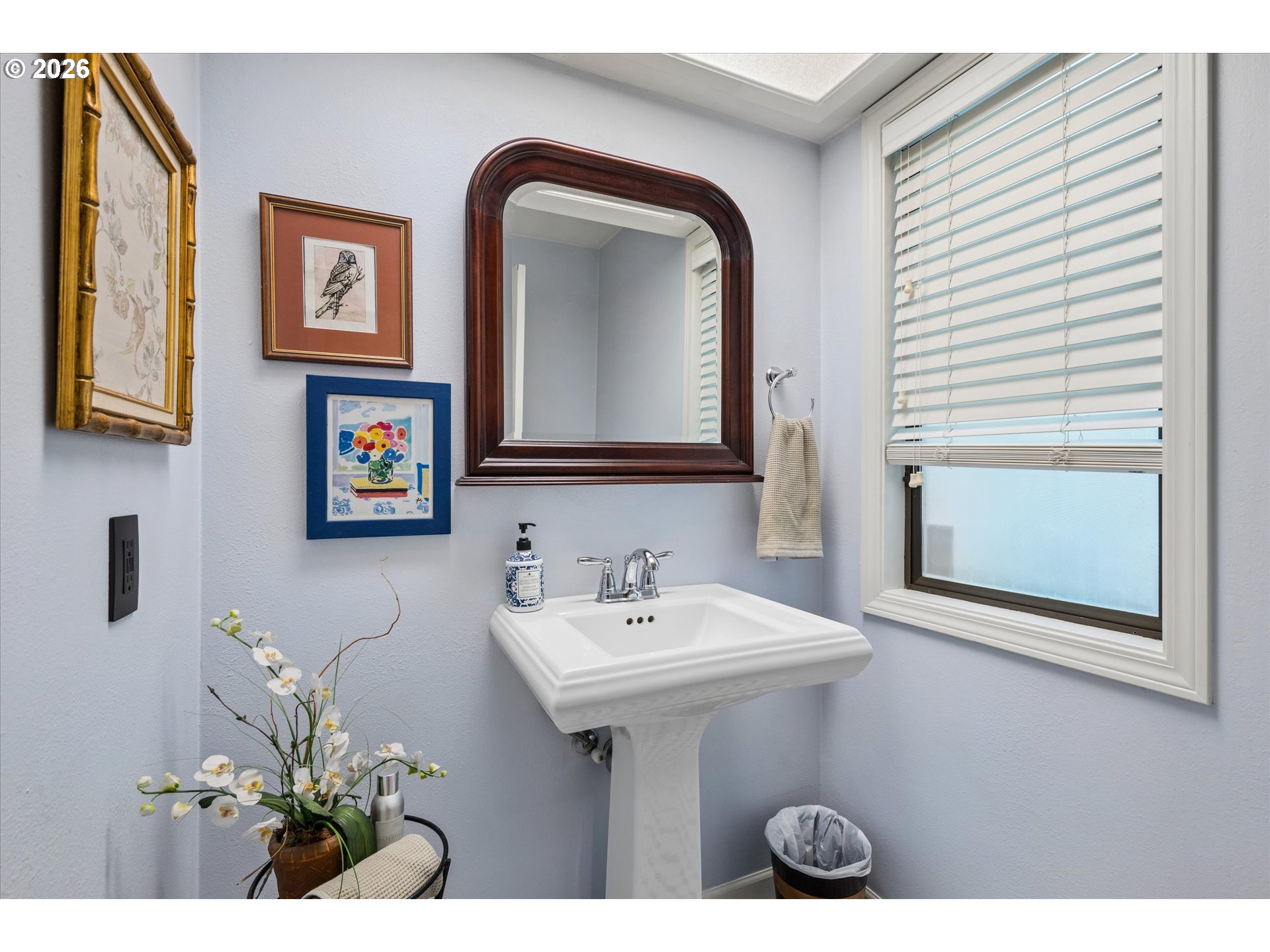599 Wimbledon Court Eugene, OR 97401 - Photo 18 of 45 a bathroom with a sink a mirror and a toilet