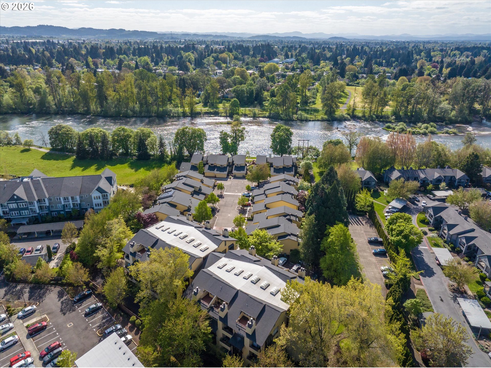 599 Wimbledon Court Eugene, OR 97401 - Photo 34 of 45 an aerial view of a house with a lake view