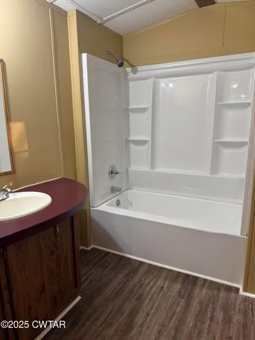 a bathroom with a bath tub and a shower