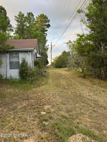 a house with trees in the background