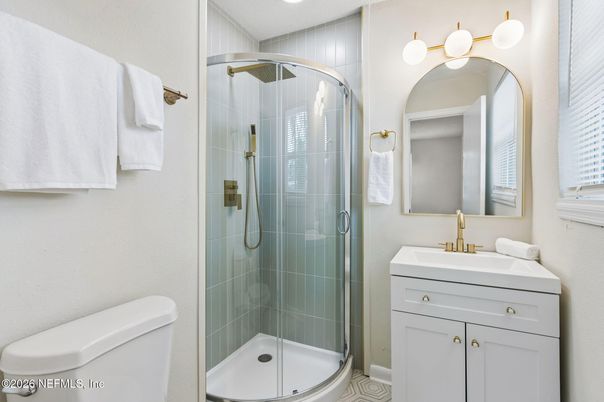 3668 Marianna Road Jacksonville, FL 32217 - Photo 18 of 27 a bathroom with a sink a toilet and shower