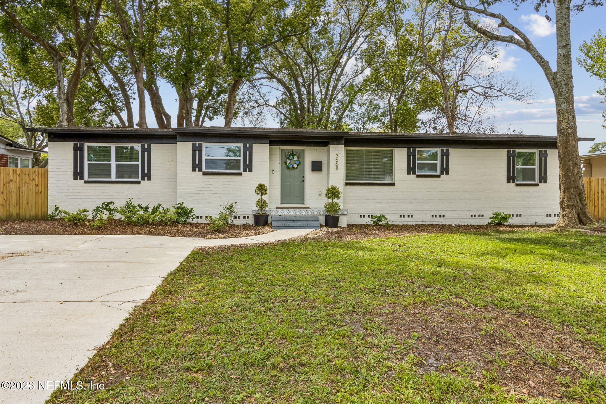 3668 Marianna Road Jacksonville, FL 32217 - Photo 2 of 27 a front view of a house with a yard