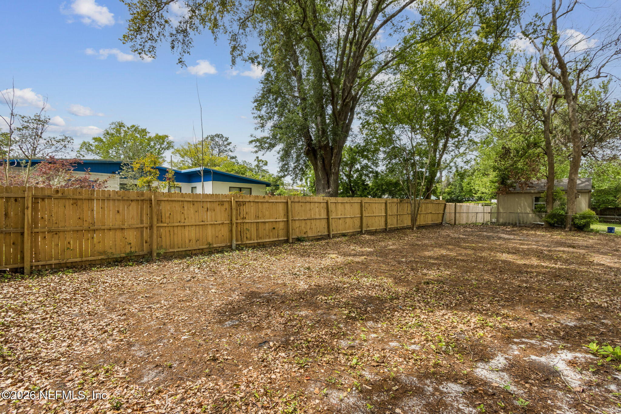 3668 Marianna Road Jacksonville, FL 32217 - Photo 27 of 27 a view of backyard with wooden fence