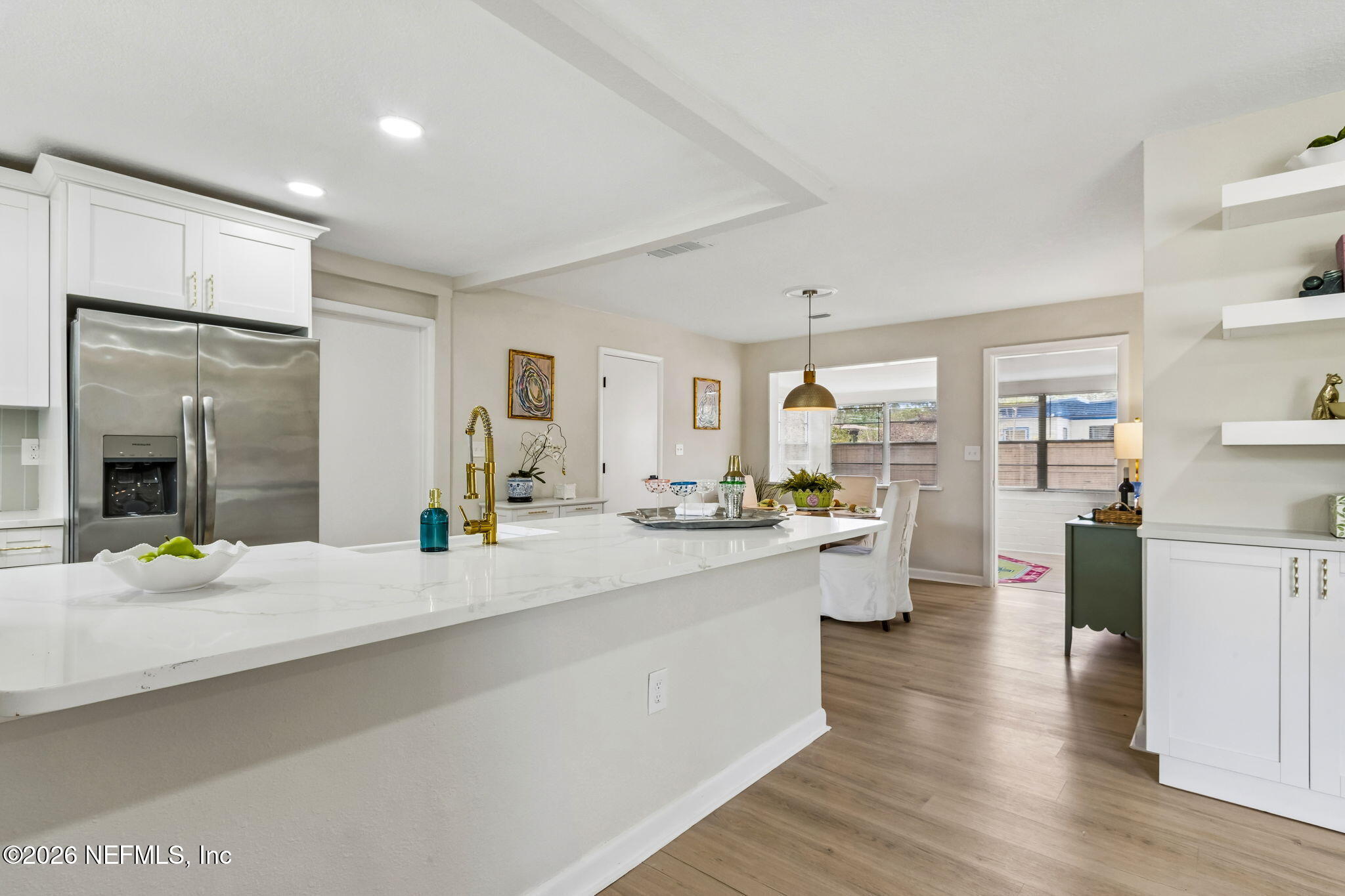 3668 Marianna Road Jacksonville, FL 32217 - Photo 7 of 27 a large white kitchen with sink and refrigerator