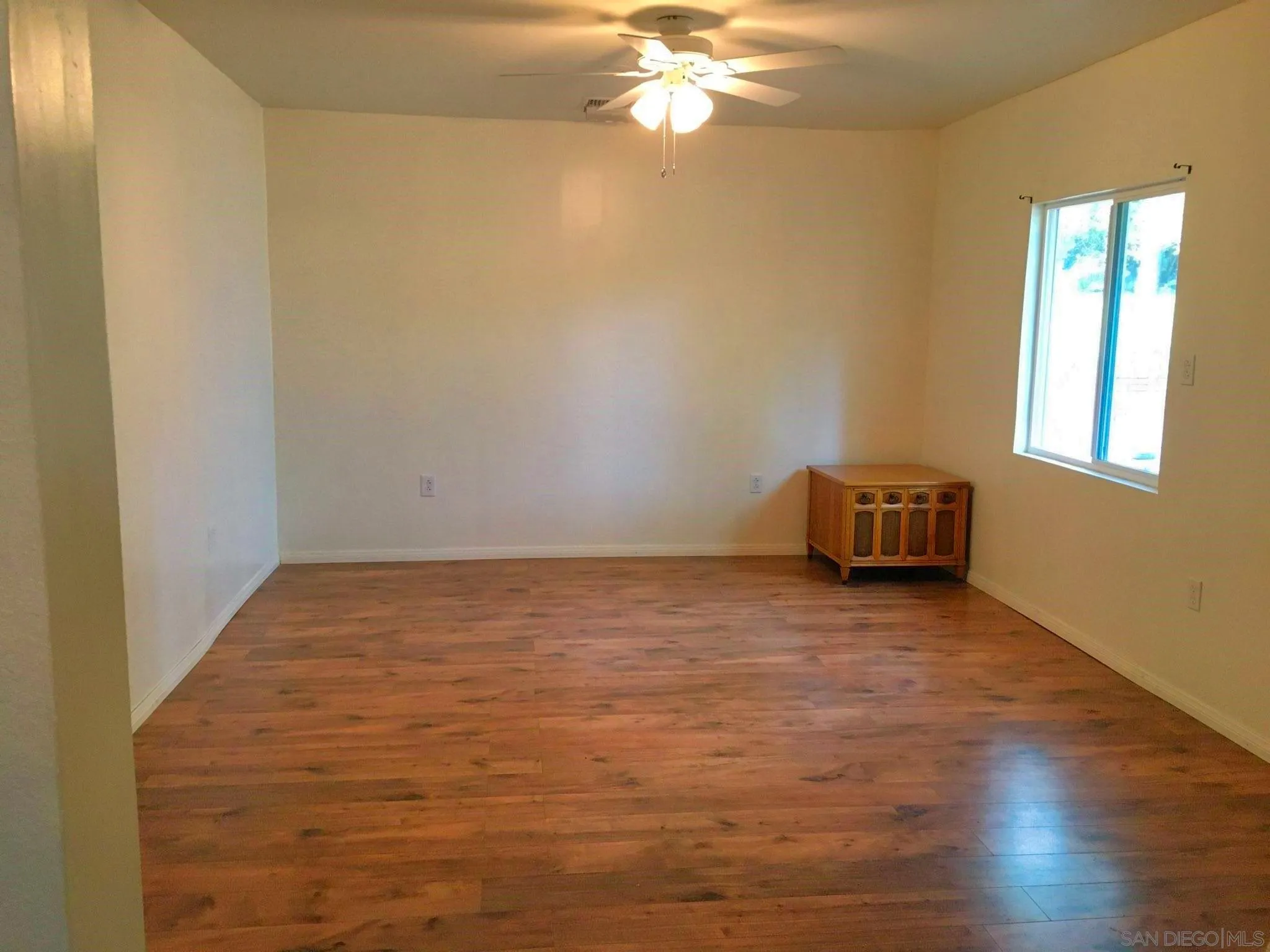 23415 Japatul Valley Road Alpine, CA 91901 - Photo 30 of 49 a view of room with hardwood floor and window