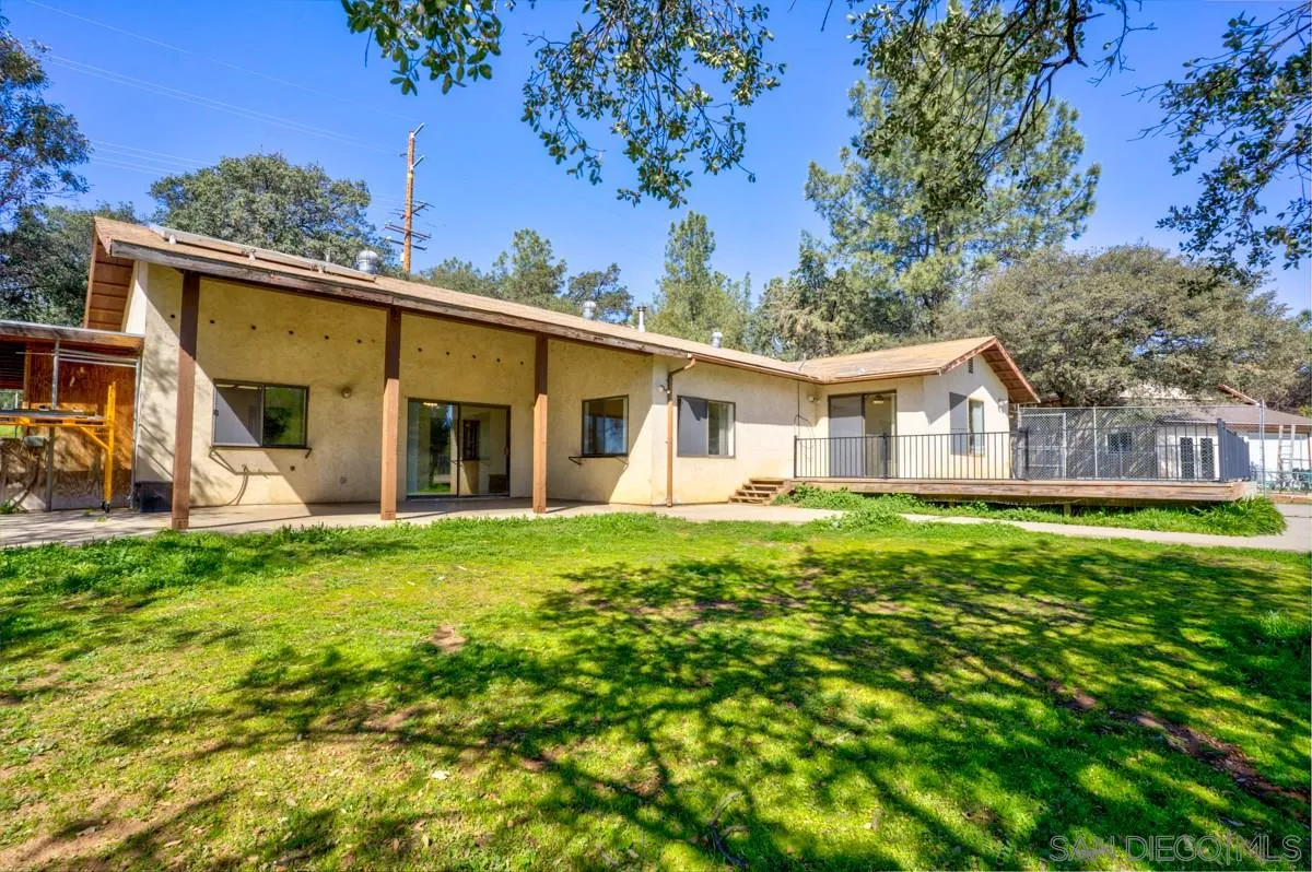 23415 Japatul Valley Road Alpine, CA 91901 - Photo 36 of 49 a view of a house with a backyard
