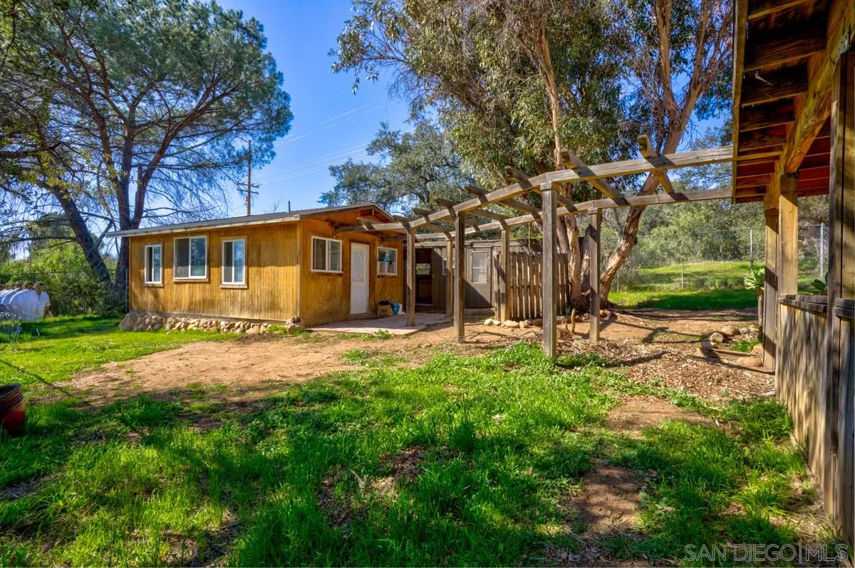 23415 Japatul Valley Road Alpine, CA 91901 - Photo 39 of 49 a view of a house with yard and tree s