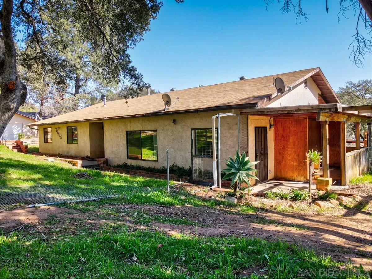 23415 Japatul Valley Road Alpine, CA 91901 - Photo 8 of 49 a front view of a house with garden