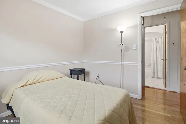 a bedroom with a bed and a closet