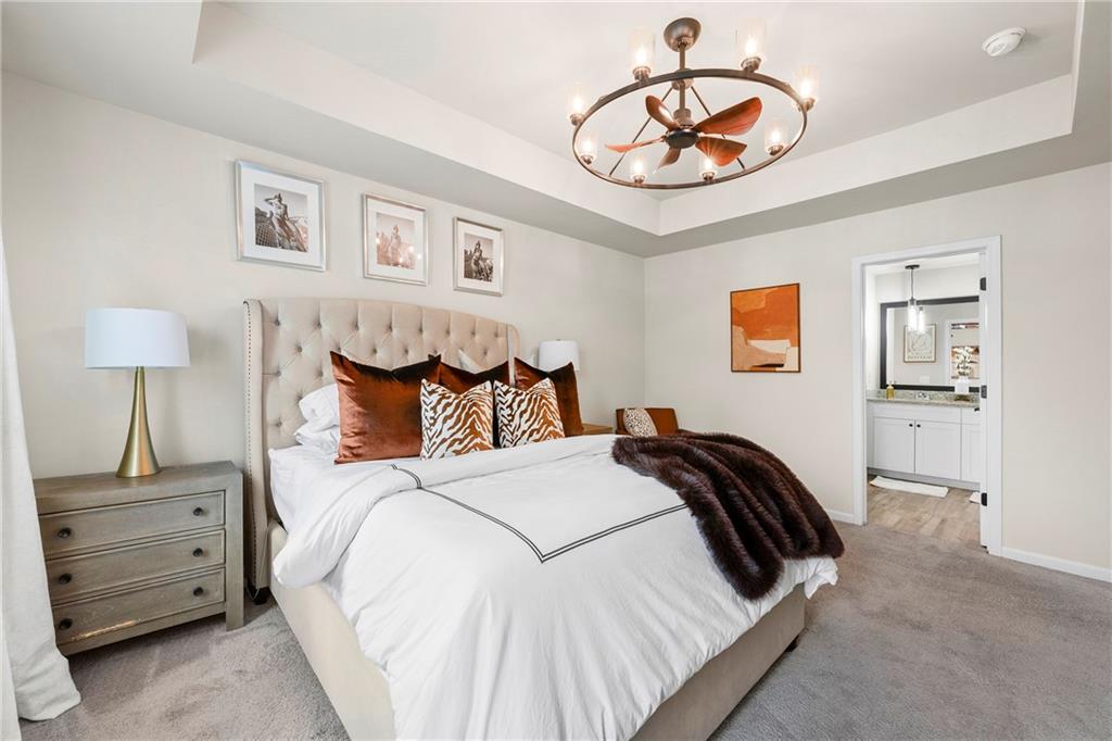 7098 Chara Lane Atlanta, GA 30331 - Photo 13 of 25 a bedroom with a bed and a chandelier