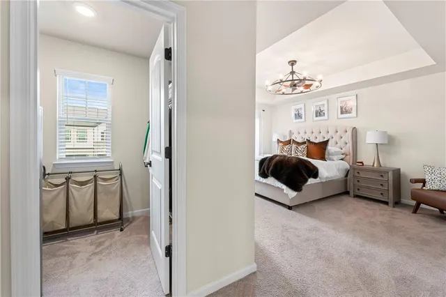 a view of walk in closet with clothes