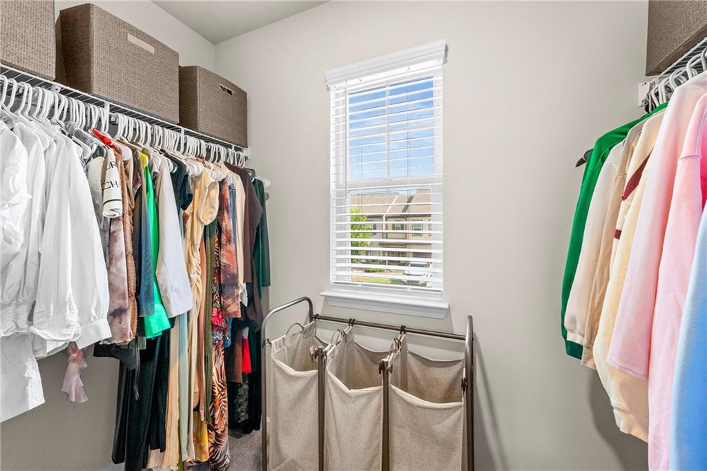 7098 Chara Lane Atlanta, GA 30331 - Photo 16 of 25 a view of walk in closet with clothes