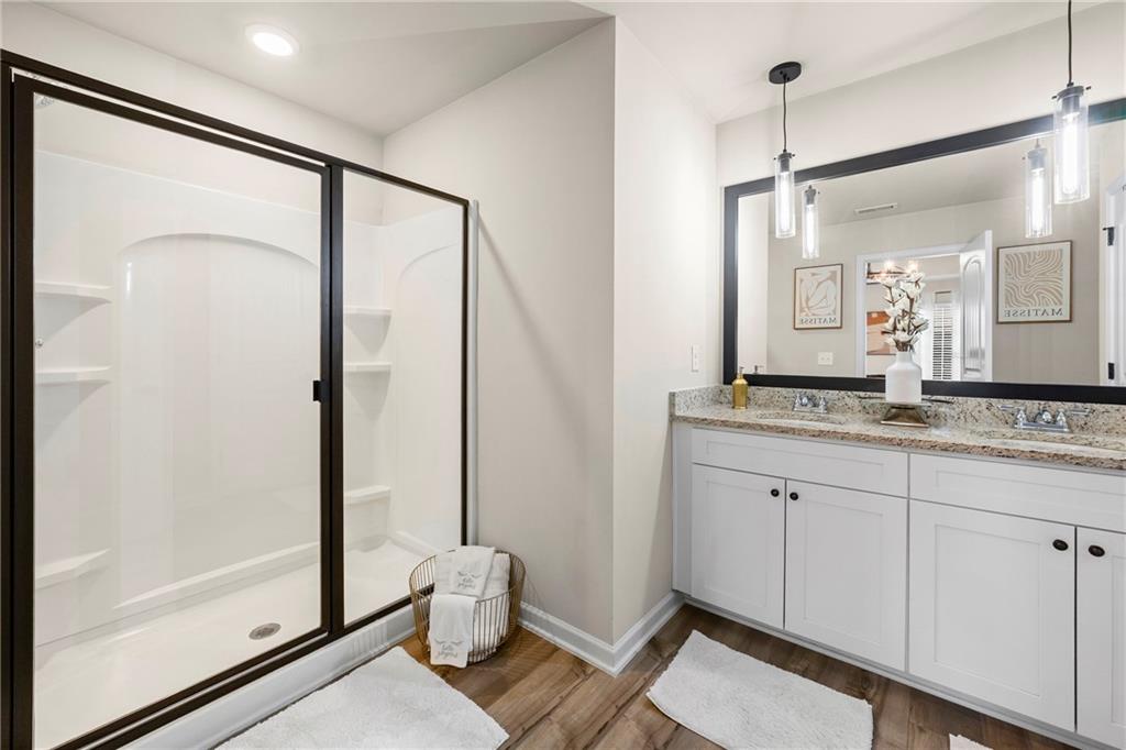 7098 Chara Lane Atlanta, GA 30331 - Photo 18 of 25 a bathroom with a granite countertop sink mirror vanity and toilet