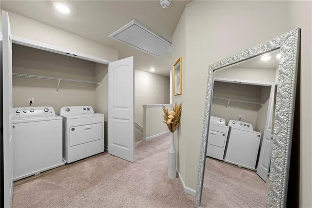 a view of a hallway with closet and wooden door