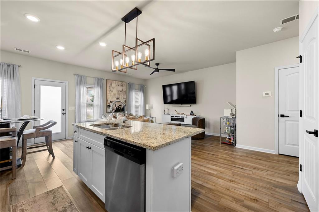 7098 Chara Lane Atlanta, GA 30331 - Photo 8 of 25 a kitchen with a sink a counter top space and stainless steel appliances