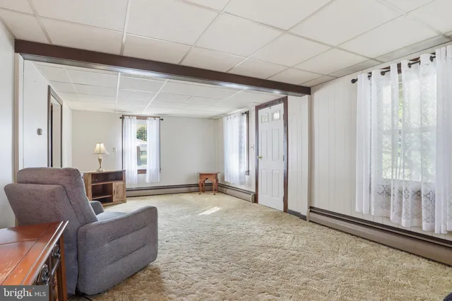 a picture of a bench in front of a wall