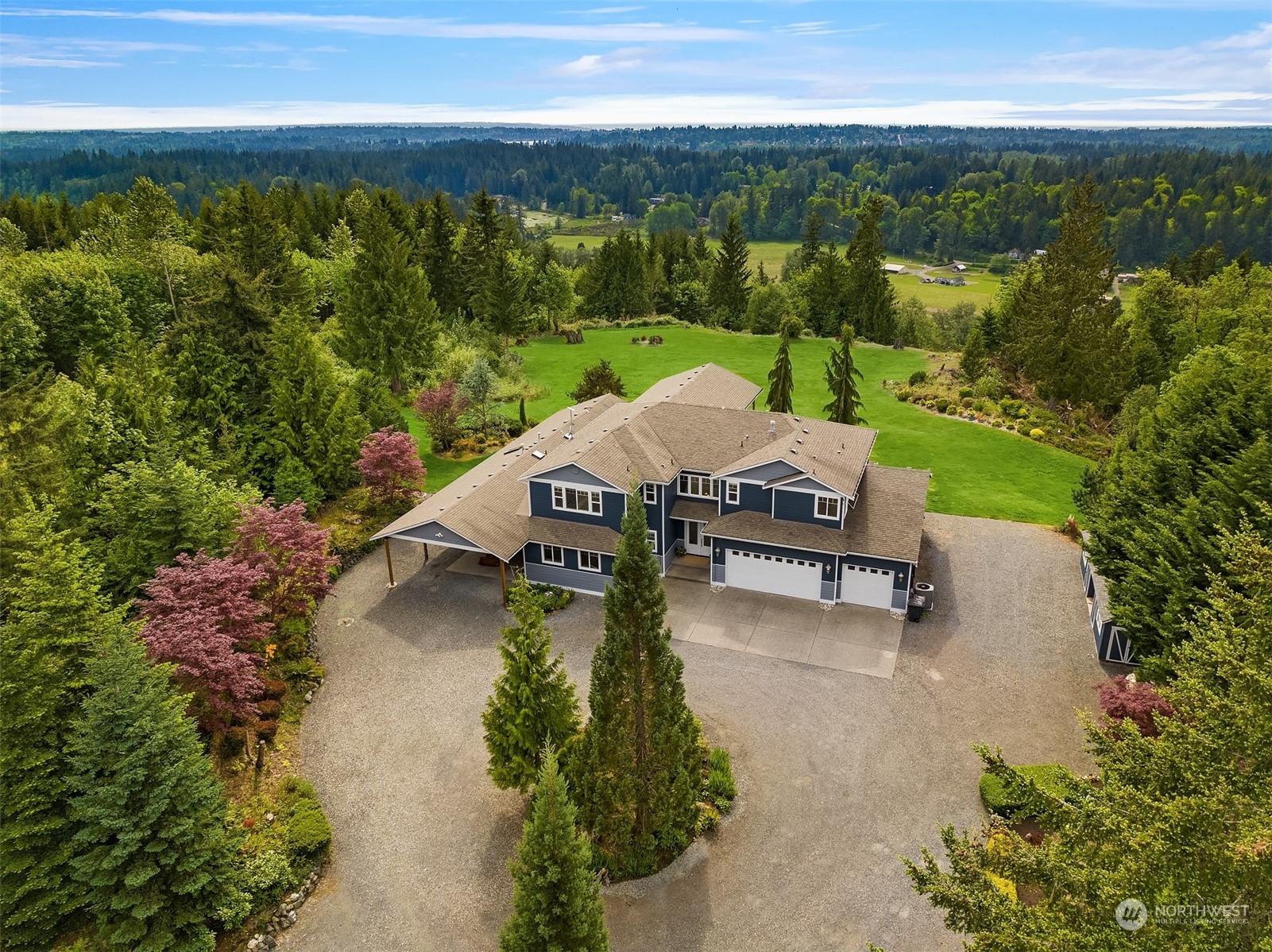 an aerial view of a garden with an outdoor seating