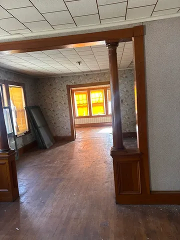 a view of an empty room and a window