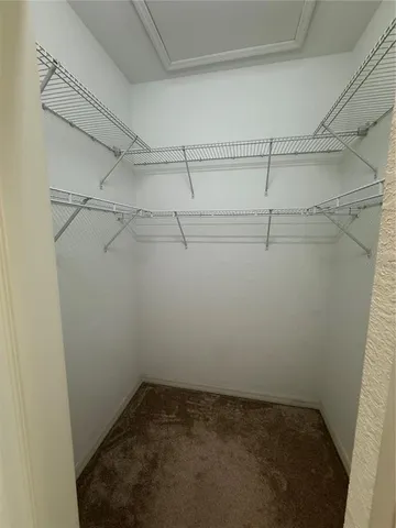 a view of a room with racks on the wall