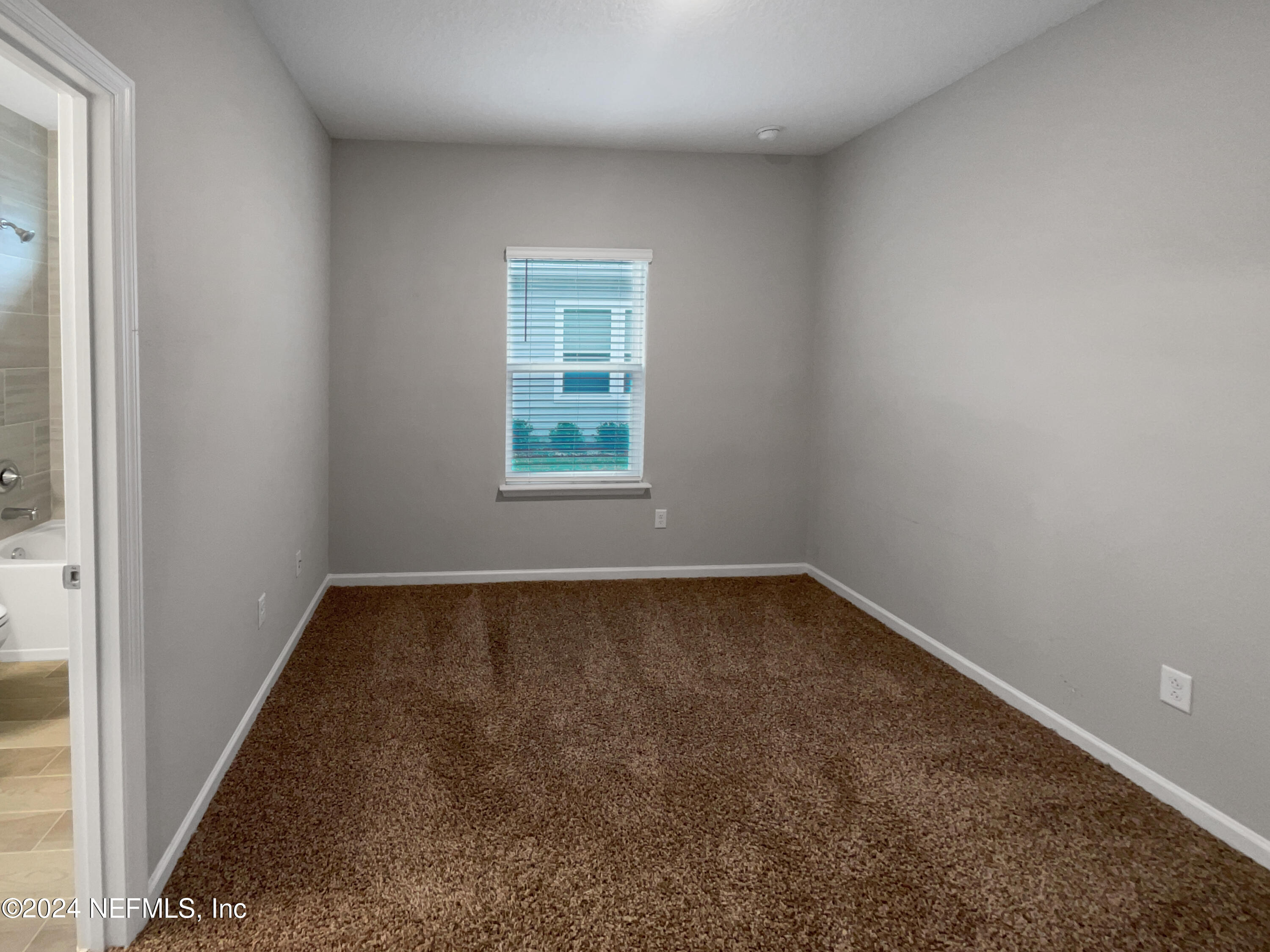 188 Bloomfield Way St. Augustine, FL 32092 - Photo 12 of 18 an empty room with a window