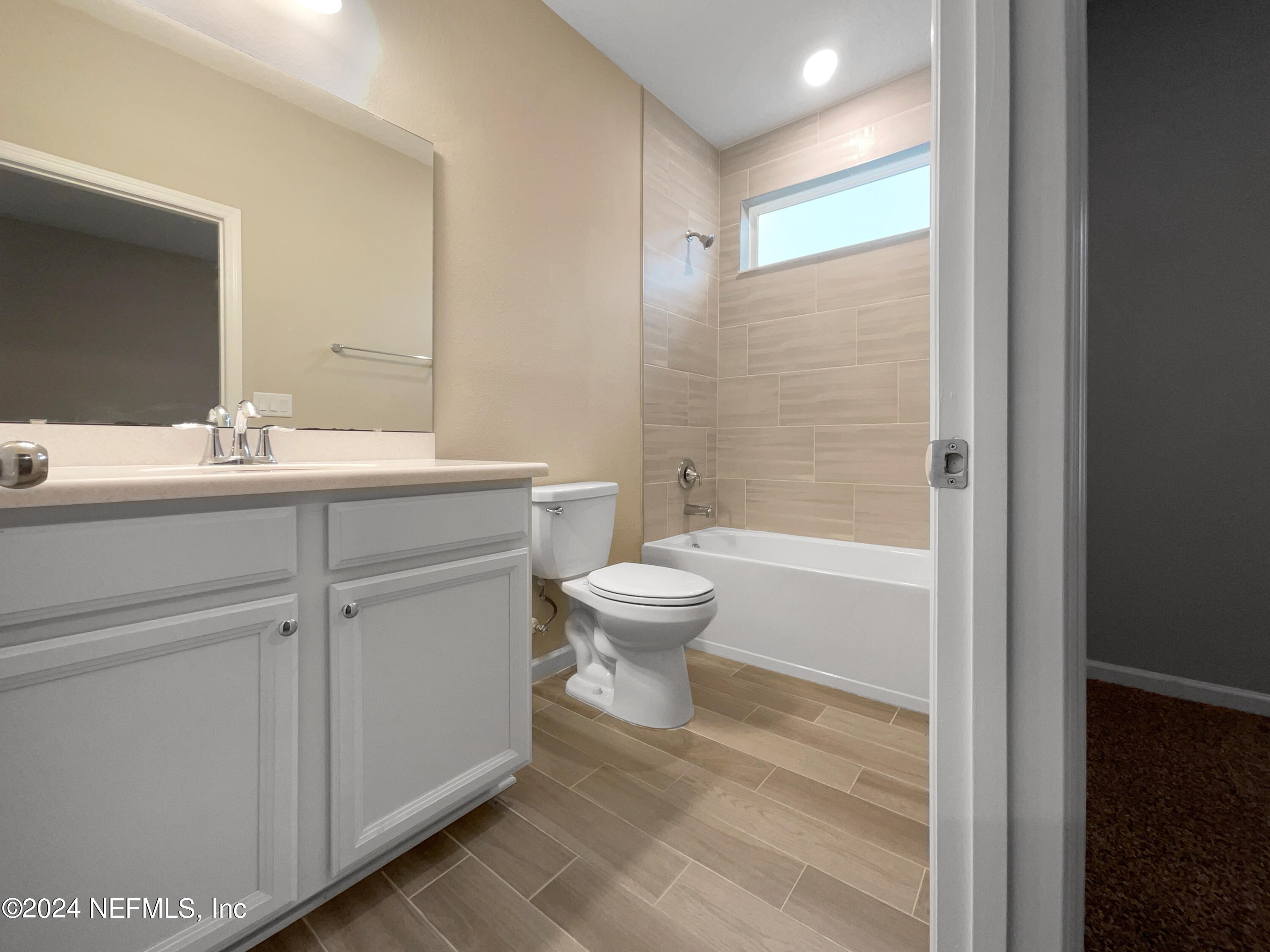 188 Bloomfield Way St. Augustine, FL 32092 - Photo 13 of 18 a bathroom with a sink a toilet and shower