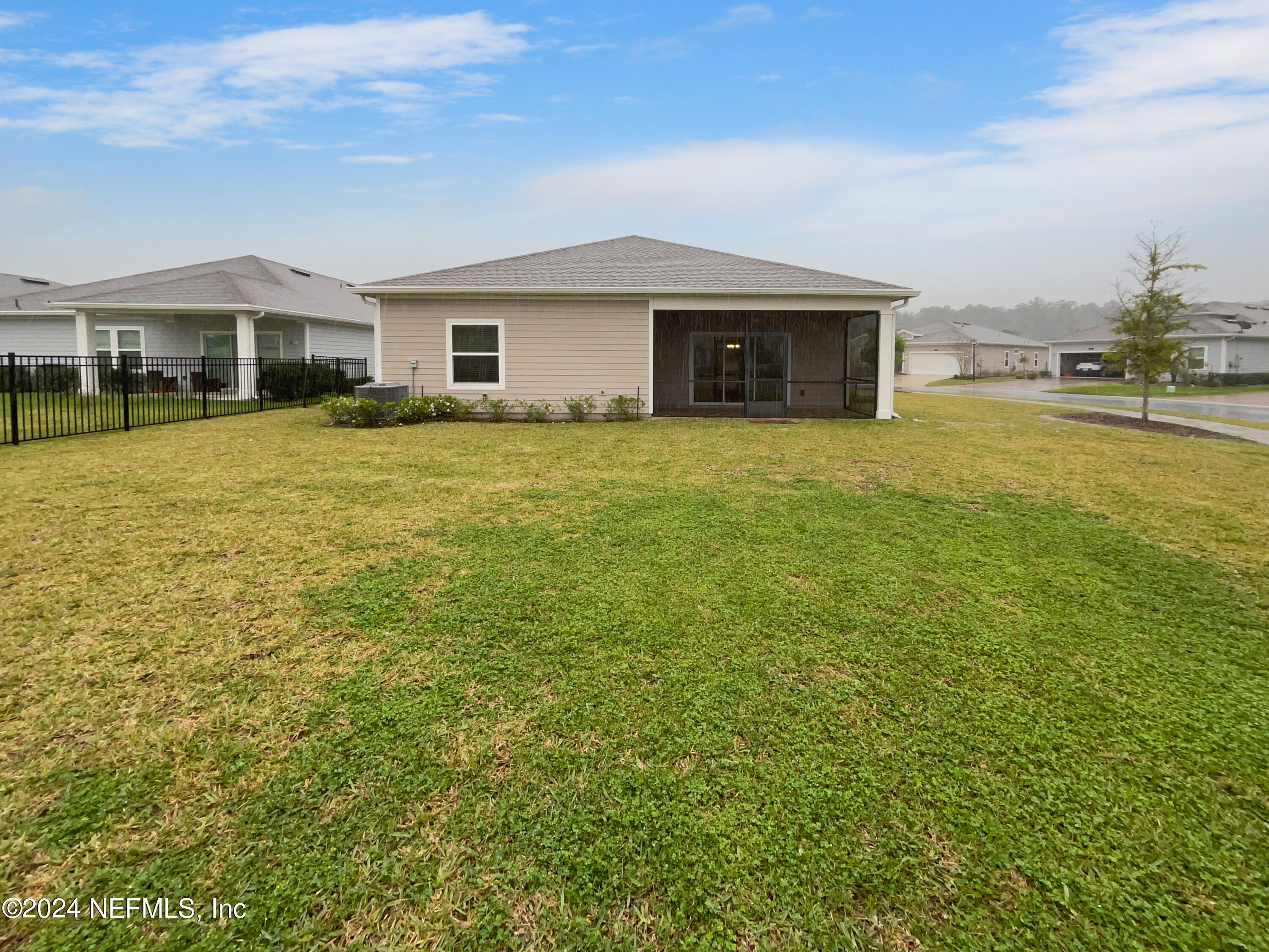 188 Bloomfield Way St. Augustine, FL 32092 - Photo 18 of 18 a front view of a house with a garden