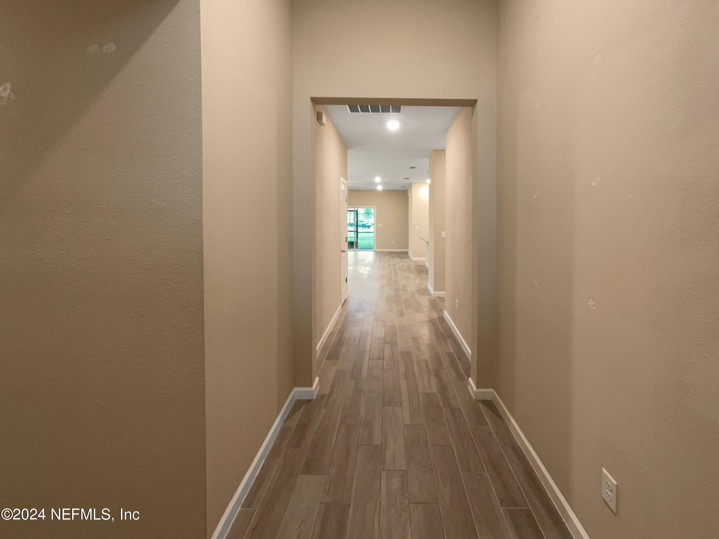 188 Bloomfield Way St. Augustine, FL 32092 - Photo 8 of 18 a view of a hallway with wooden floor