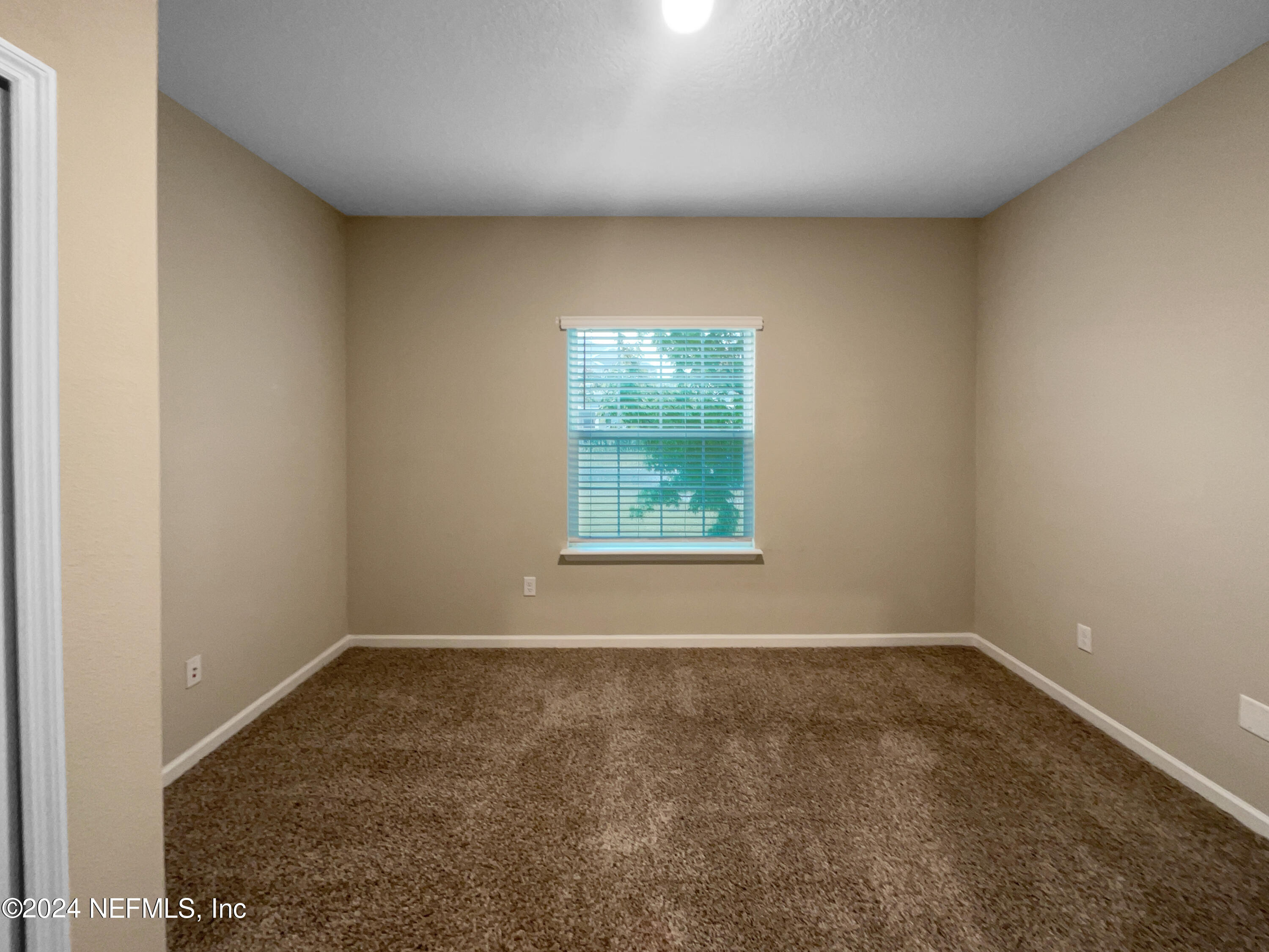 188 Bloomfield Way St. Augustine, FL 32092 - Photo 9 of 18 an empty room with a window
