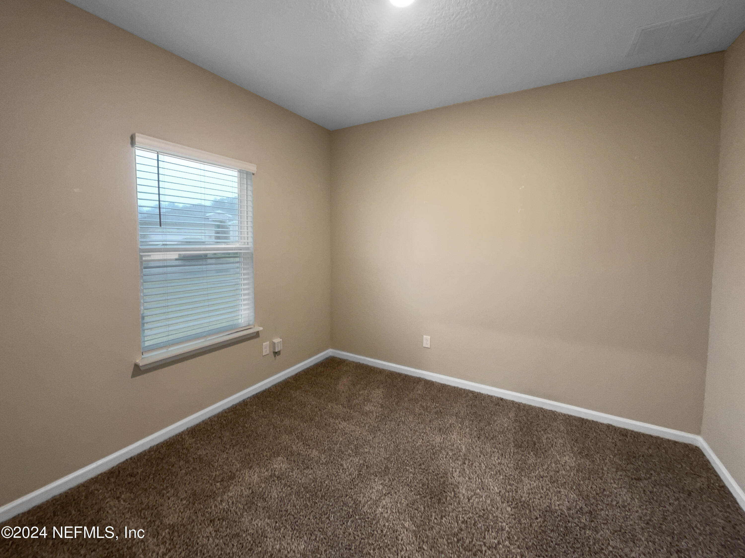 188 Bloomfield Way St. Augustine, FL 32092 - Photo 10 of 18 an empty room with a window