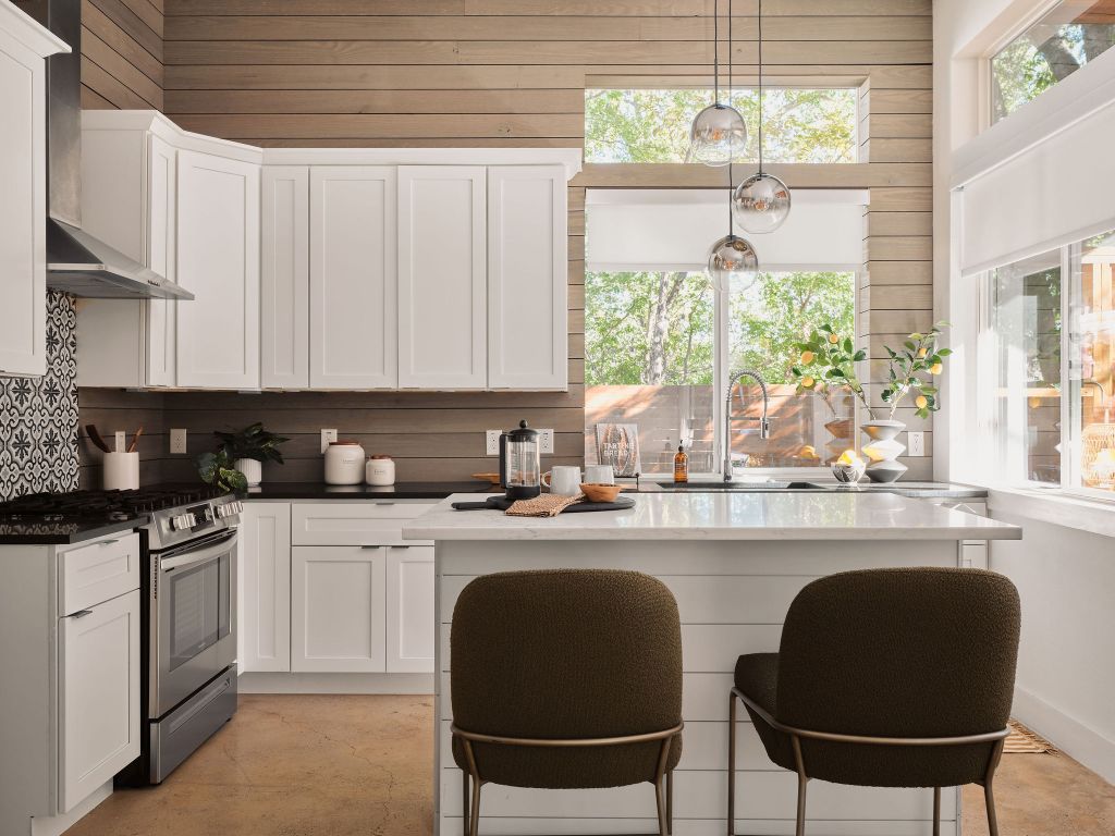 2806 Lyons Road, Unit 1 Austin, TX 78702 - Photo 14 of 39 a kitchen with stainless steel appliances granite countertop a stove a sink and white cabinets