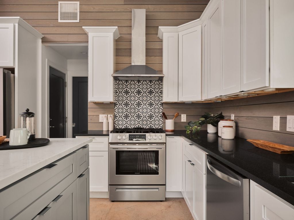 2806 Lyons Road, Unit 1 Austin, TX 78702 - Photo 16 of 39 a kitchen with granite countertop white cabinets and white appliances