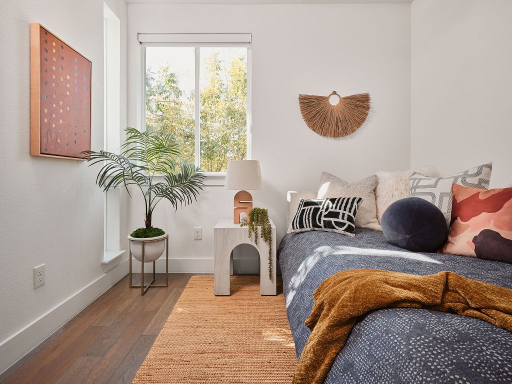 2806 Lyons Road, Unit 1 Austin, TX 78702 - Photo 24 of 39 a bedroom with furniture and a large window