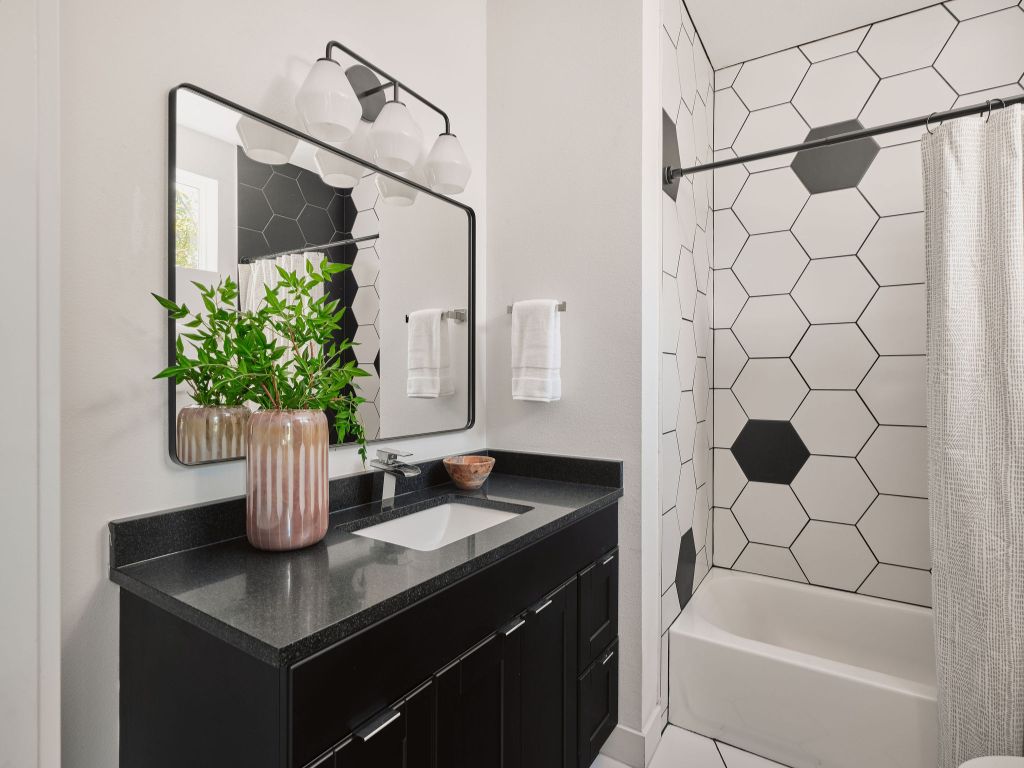 2806 Lyons Road, Unit 1 Austin, TX 78702 - Photo 25 of 39 a bath room with a sink and a mirror