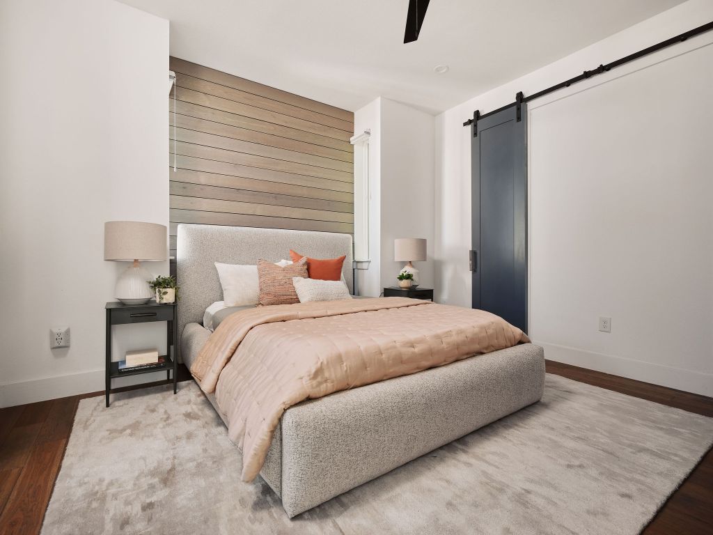 2806 Lyons Road, Unit 1 Austin, TX 78702 - Photo 28 of 39 a bedroom with a bed and a night stand