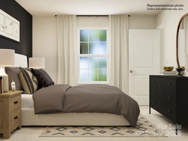 a living room with a couch and a dresser