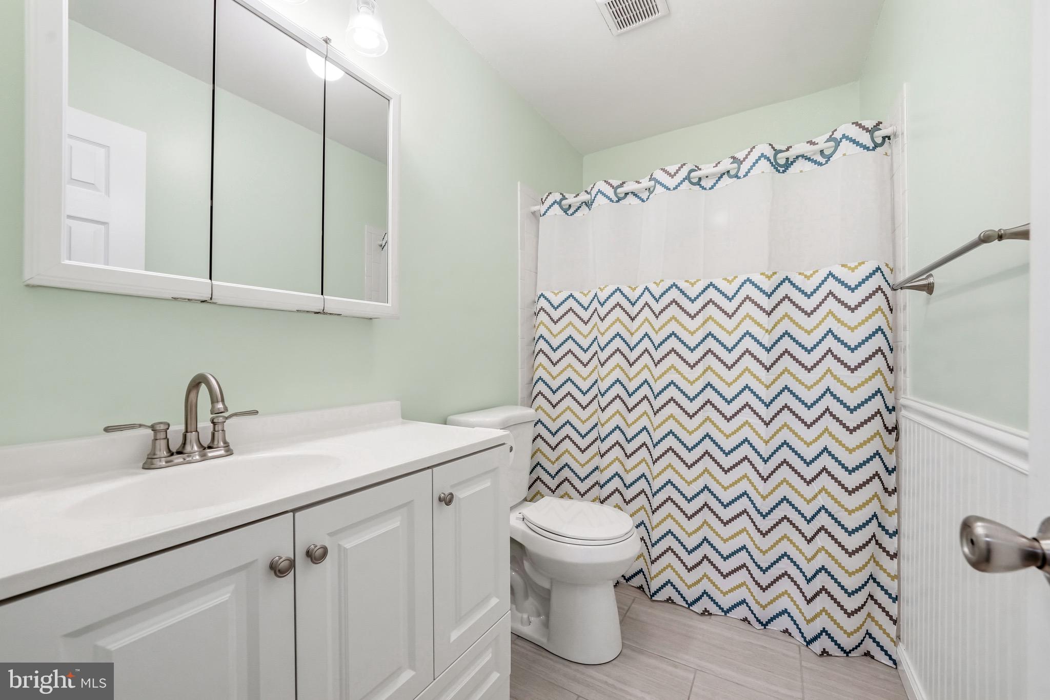 1038 Estates Boulevard Hamilton, NJ 08690 - Photo 35 of 47 a bathroom with a sink a toilet and a mirror