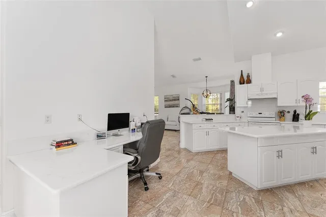 a spacious bedroom with a bed and a couch