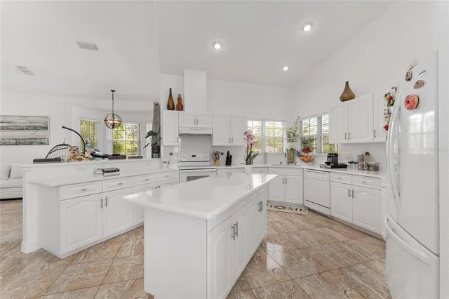 a bedroom with a large bed and a large window