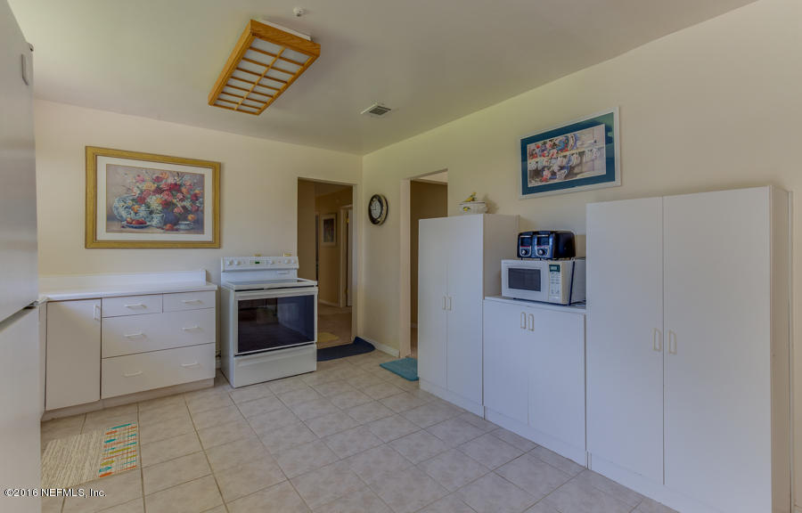 6615 Diane Road Jacksonville, FL 32277 - Photo 14 of 23 a view of a livingroom with washer and dryer