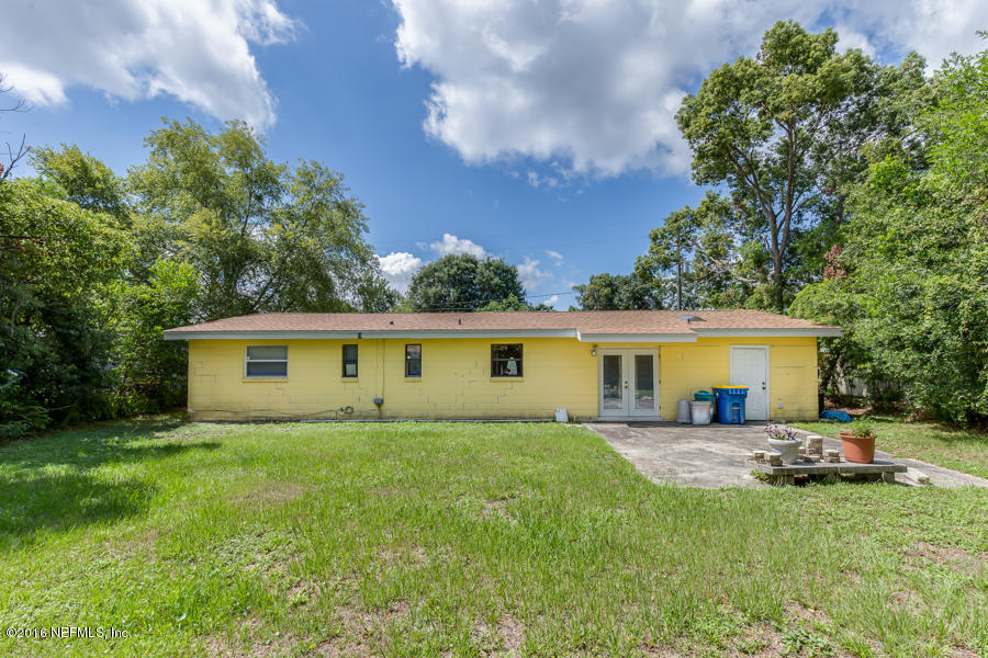 6615 Diane Road Jacksonville, FL 32277 - Photo 22 of 23 a view of a house with a yard