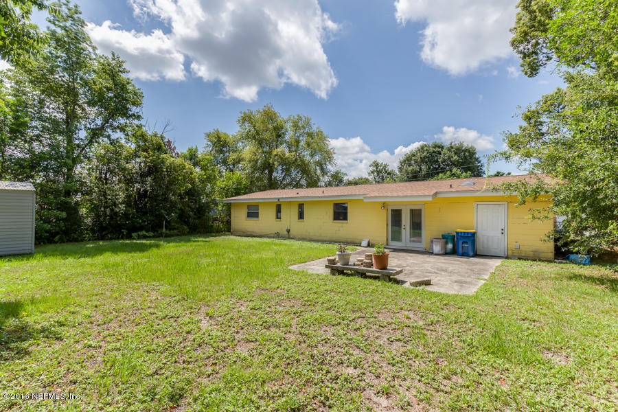 6615 Diane Road Jacksonville, FL 32277 - Photo 23 of 23 a house view with a sitting space and garden