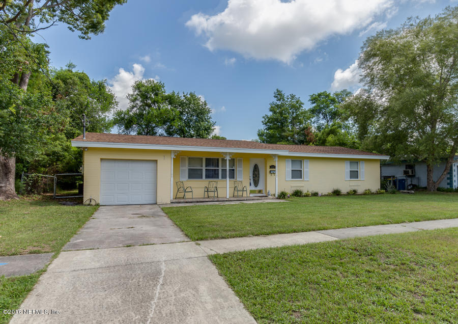 6615 Diane Road Jacksonville, FL 32277 - Photo 4 of 23 a front view of a house with a yard and trees