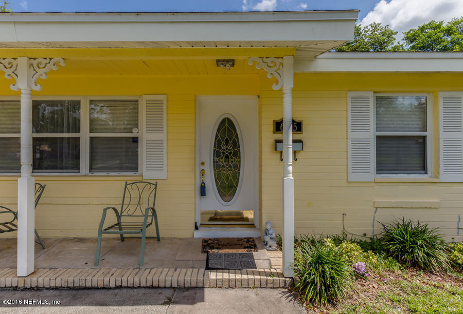 6615 Diane Road Jacksonville, FL 32277 - Photo 7 of 23 a front view of a house with a garden