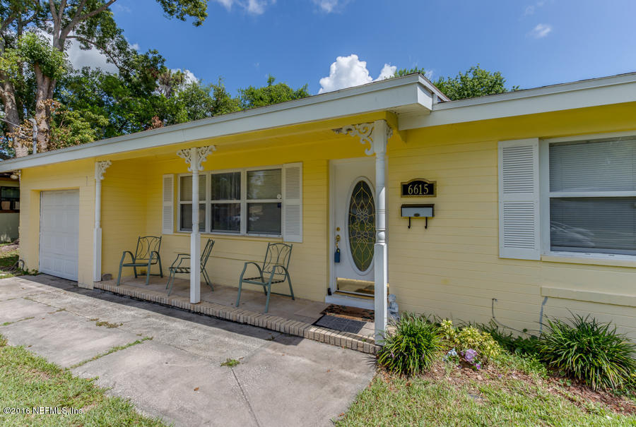 6615 Diane Road Jacksonville, FL 32277 - Photo 8 of 23 a front view of a house with a yard
