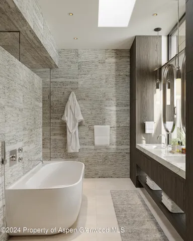 a bathroom with a bathtub and a sink